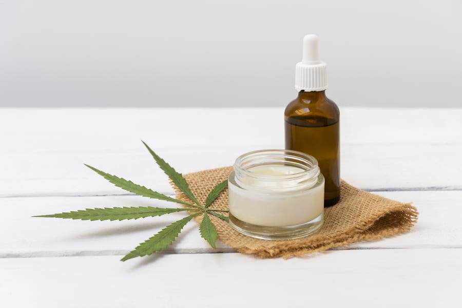 cannabis infused cosmetics concept cbd cream hemp oil white background with copy space