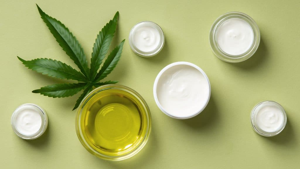 CBD oil products and cannabis leaf